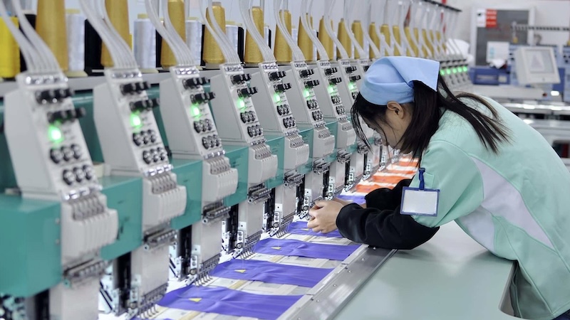 Workers assembling products in China factory