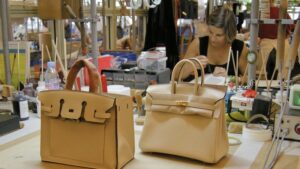 Buying agent checking handbag samples