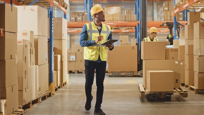 Inspector examining products in warehouse