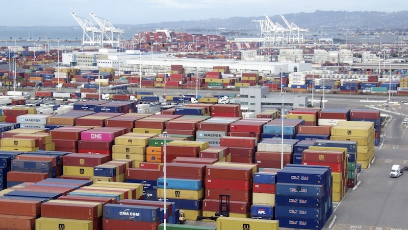 Shipping containers stacked at port yard