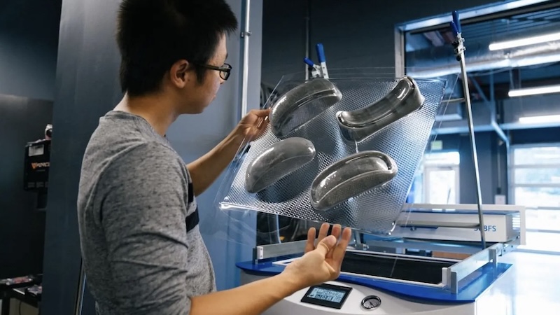 Engineer holding 3D printed prototype