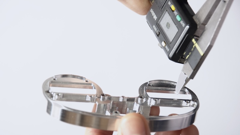 Inspector checking quality of metal product
